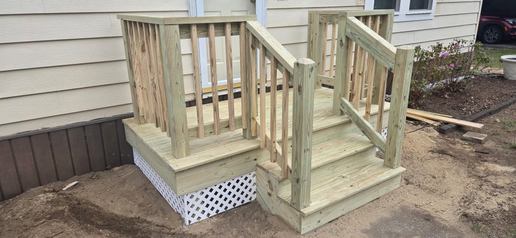 Completed wooden front entry steps and landing replacement project