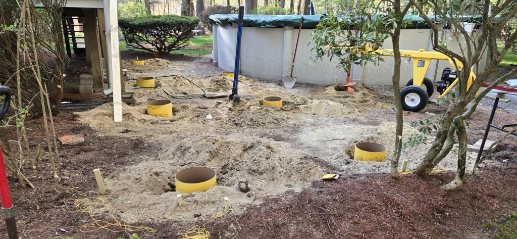 Footings dug out with sauna tubes for a pool deck build