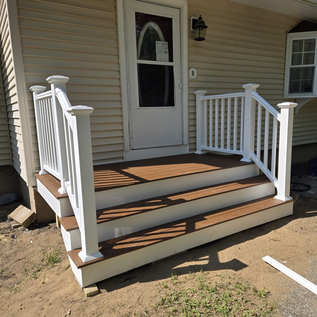 Replacement Composite front entry steps in concord nh with white vinyl railing